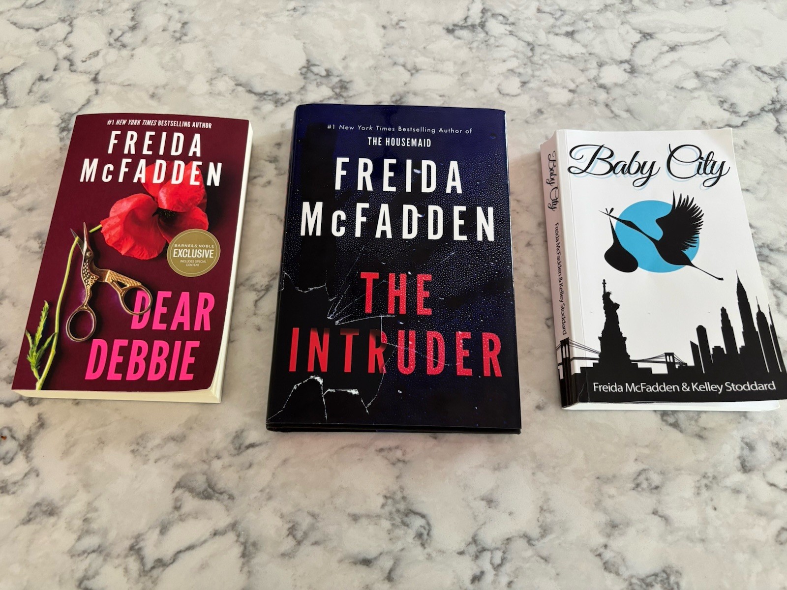 Freida McFadden – Dear Debbie (pb), The Intruder (hardcover), Baby City (pb)
